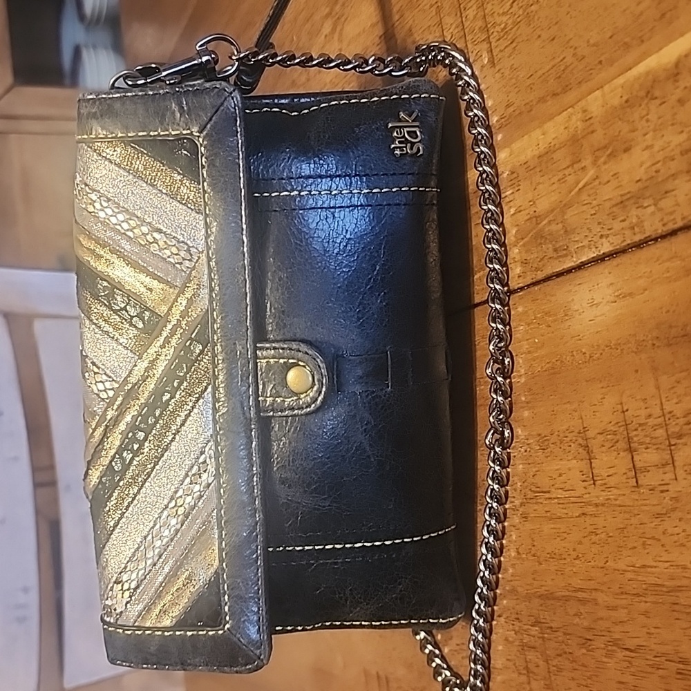 The Sak Black and Gold Clutch
